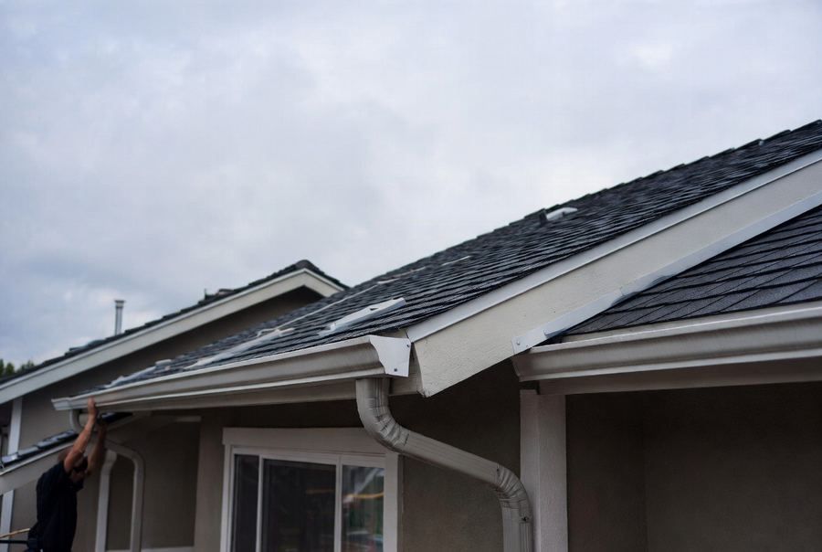 New gutter installed along a roofline