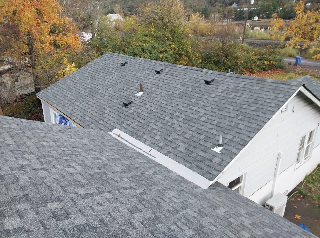 Asphalt shingle roof in autumn